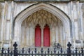 WINCHESTER, UK - FEBRUARY 5, 2017: Detail of the main entrance to the Cathedral with red doors and arches Royalty Free Stock Photo