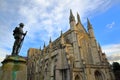 WINCHESTER, UK - FEBRUARY 4, 2017: Exterior view of the Cathedral with the statue of First World War Soldier in the foreground