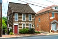 Old two-story log house with large windows Royalty Free Stock Photo