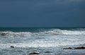 WIND BLOWING SPRAY FROM THE SURF ON A WAVE IN THE OCEAN. Royalty Free Stock Photo