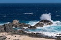 Wind blowing the water and waves against the rocks on the beautiful coast Royalty Free Stock Photo