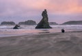 Wind blown sand on beach at sunset