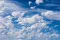 Wind blows lots of clouds over blue sky Royalty Free Stock Photo