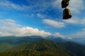 The wind chime with the background of continous mountains Royalty Free Stock Photo