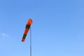 Wind cone against blue sky. Royalty Free Stock Photo