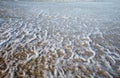 Seafoam on the beach