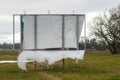 Wind damaged advertising banner on the side of the road Royalty Free Stock Photo