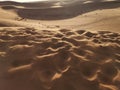Wind on desert dunes Erg Chebbi, Sahara Desert, Morocco Royalty Free Stock Photo