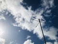 Wind direction indicator, with the cumulus sky background. Royalty Free Stock Photo