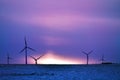 Wind driven electric plant on snow Royalty Free Stock Photo