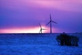 Wind driven electric plant in winter Royalty Free Stock Photo