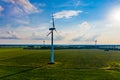 Wind energy concept. Turbines in rural area to supply countryside with electricity. Aerial landscape Royalty Free Stock Photo