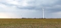 Wind energy concept. Turbines in rural area to supply countryside with electricity Royalty Free Stock Photo