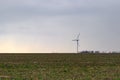 Wind energy concept. Turbines in rural area to supply countryside with electricity Royalty Free Stock Photo