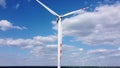 Aerial view of wind turbine on blue sky