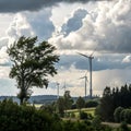 Wind Energy Landscape with Clouds and Trees Royalty Free Stock Photo