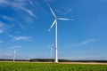Wind energy plants in front of a blue sky Royalty Free Stock Photo