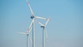 Wind energy.Windmills on a blue sky background.Wind generators. Natural energy.Alternative energy sources Royalty Free Stock Photo