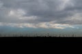 Wind energy windmills silhouetted on the horizon in Spain Royalty Free Stock Photo