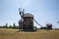 Wind Farm. Dutch windmill. Landscape with traditional Ukrainian windmills houses in countryside village. Windmill mill at rural Royalty Free Stock Photo