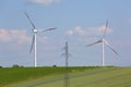 Wind farm, ecological windmills producing electricity without burning fuel and electric pole