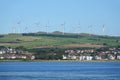 Wind turbines on hill above town