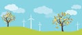 Wind farm in green fields among trees. Ecological or environmental background for presentations, websites and infographics Royalty Free Stock Photo