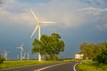 Wind farm with many wind turbines beside a country road Royalty Free Stock Photo