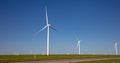 Wind turbines, renewable energy on a green field, spring day. Wind farm, New Mexico, USA Royalty Free Stock Photo