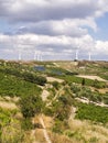 Wind Farm and Olive field with blue sky and clouds at Crete Island, Greece Royalty Free Stock Photo