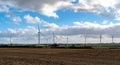 Wind farm park near Yelvertoft on bright cloudy day