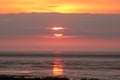 Wind farm sunset sun reflected in Pilling sands Royalty Free Stock Photo