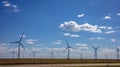 Wind turbines, renewable energy on a green field, spring day. Wind farm, West Texas, USA Royalty Free Stock Photo