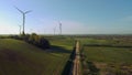 Wind farm towers surrounded by agricultural fields Royalty Free Stock Photo