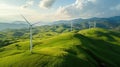 Wind farm with turbines on top of hill aerial view on a sunny day