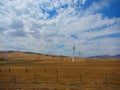 Wind farm, view of hundreds of wind trubines in mountainous fields in California.