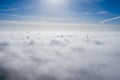 Wind farms sticking out above the clouds Royalty Free Stock Photo