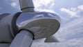 Wind generator close up. Chromed spinner reflecting sky, clouds and ground. 3D rendering