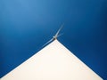 Wind generator for producing clean ecologic energy. Minimalistic bottom view with dramatic perspective