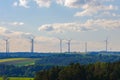 Wind generator silhouettes on the green hills.Windmill set background.Green energy. renewable energy.Environmentally Royalty Free Stock Photo