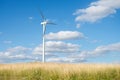 Wind generator turbine on summer landscape Royalty Free Stock Photo