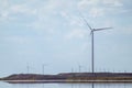 Wind generators energy farm on sea coast Royalty Free Stock Photo