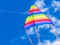 Wind kite flying in a blue sky Royalty Free Stock Photo