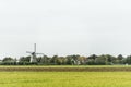 Wind mill in Dutch landscape Royalty Free Stock Photo