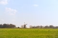 Wind mill in Dutch village Royalty Free Stock Photo