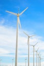 Wind mill power plant against blue sky Royalty Free Stock Photo