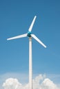 Wind mill power plant against blue sky