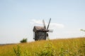 Wind mill. Windmill in a rural area. Wind Farm. Dutch windmill. Landscape with traditional Ukrainian windmills houses in Royalty Free Stock Photo