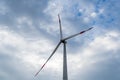 Wind power complex of Rosatom.  Blades on towers of wind turbines at sunset against cloudy sky. Close-up. Adyghe wind farm Royalty Free Stock Photo