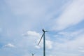 Wind power plant on the background of bright cloudy sky. wind generator close-up. green electricity, alternative energy Royalty Free Stock Photo